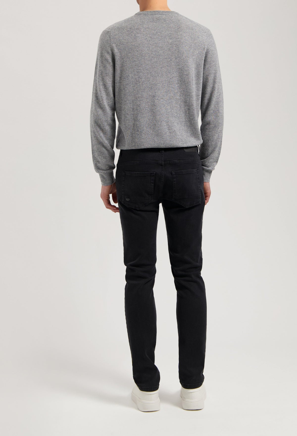 Sustainable MUD Jeans in deep blue denim, crafted from eco-friendly materials, featuring a modern slim fit and ethical design.